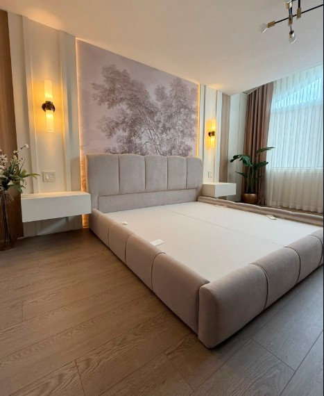 Custom upholstered bed with mural feature wall and integrated side tables