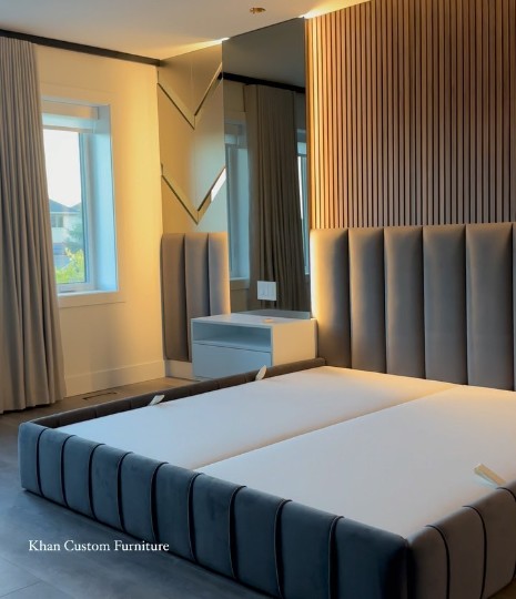 Custom grey channel bed with a warm wood-slat feature wall